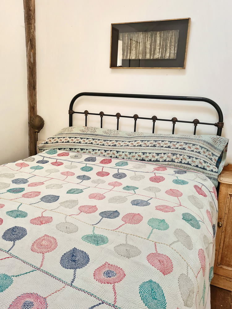 Exquisite vintage Kantha quilt featuring authentic hand-stitched Indian patchwork, responsibly sourced and perfect as unique homeware.