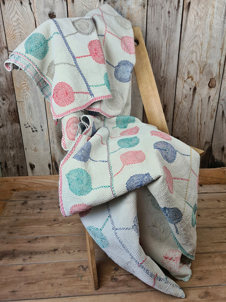 Exquisite vintage Kantha quilt featuring authentic hand-stitched Indian patchwork, responsibly sourced and perfect as unique homeware.
