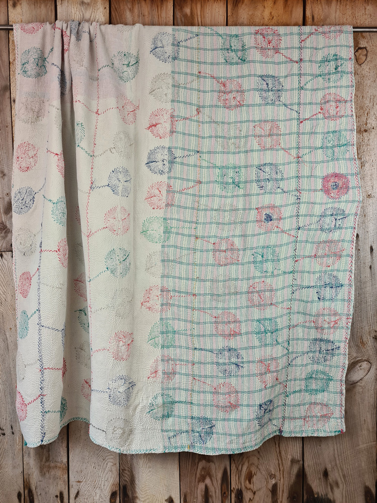 Exquisite vintage Kantha quilt featuring authentic hand-stitched Indian patchwork, responsibly sourced and perfect as unique homeware.