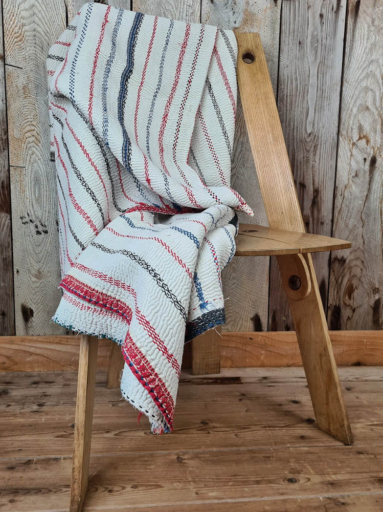 Exquisite vintage Kantha quilt featuring authentic hand-stitched Indian patchwork, responsibly sourced and perfect as unique homeware.