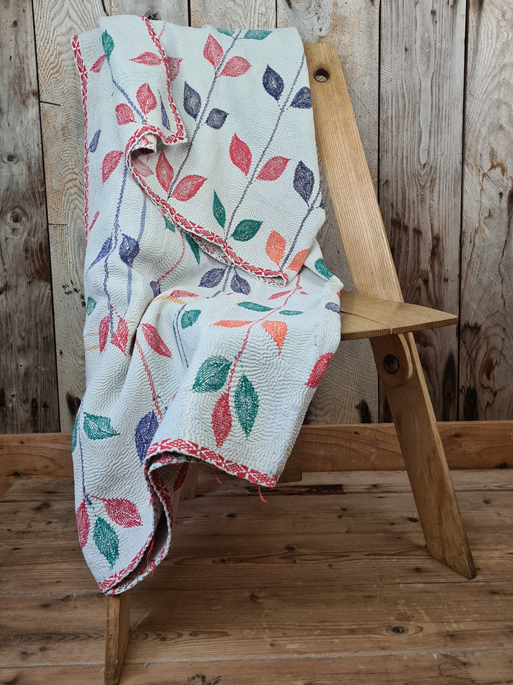 Exquisite vintage Kantha quilt featuring authentic hand-stitched Indian patchwork, responsibly sourced and perfect as unique homeware.