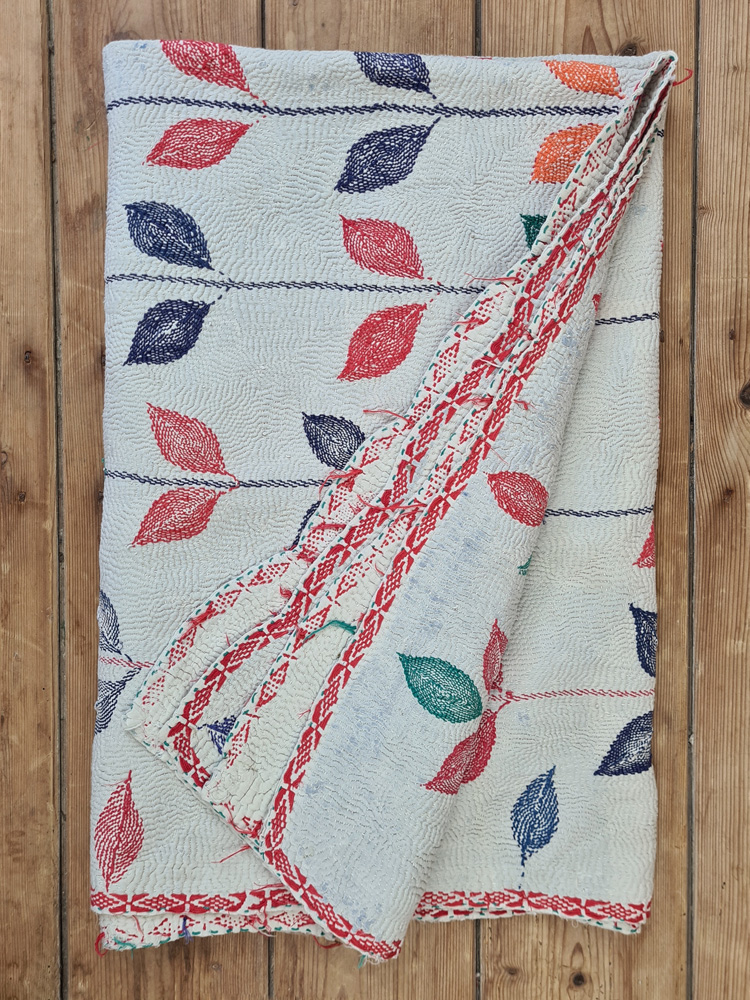 Exquisite vintage Kantha quilt featuring authentic hand-stitched Indian patchwork, responsibly sourced and perfect as unique homeware.