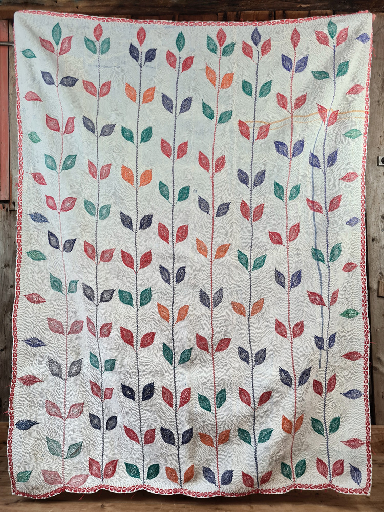 Exquisite vintage Kantha quilt featuring authentic hand-stitched Indian patchwork, responsibly sourced and perfect as unique homeware.