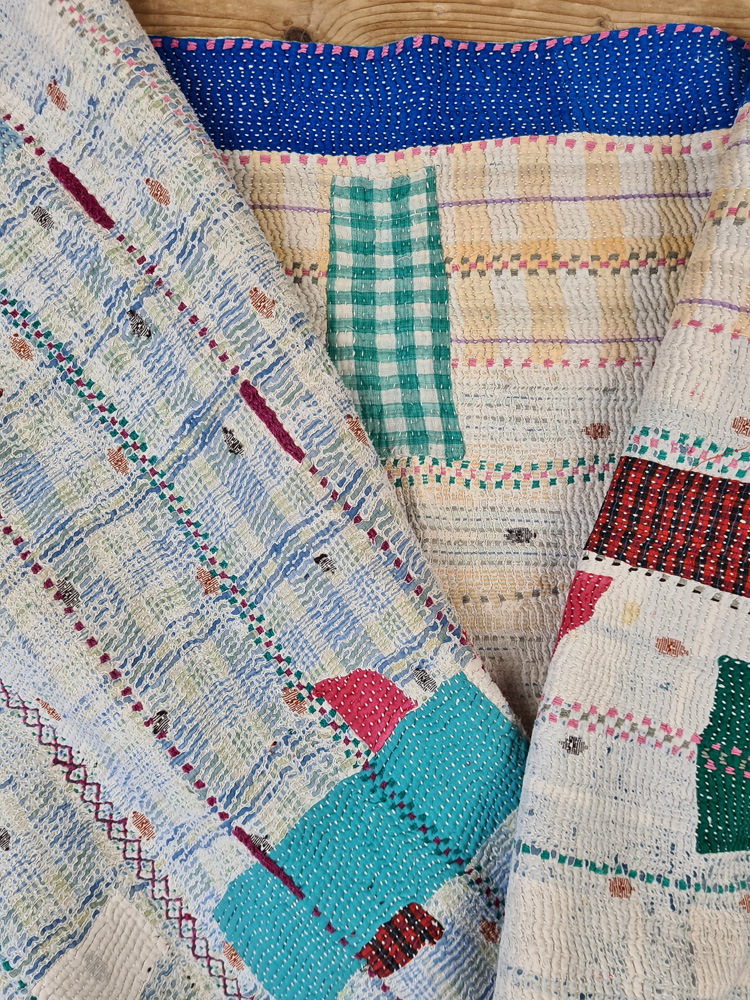 Exquisite vintage Kantha quilt featuring authentic hand-stitched Indian patchwork, responsibly sourced and perfect as unique homeware.