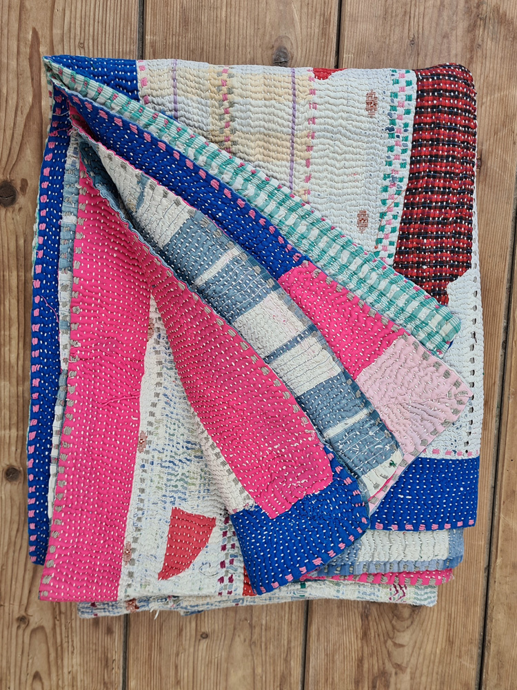 Exquisite vintage Kantha quilt featuring authentic hand-stitched Indian patchwork, responsibly sourced and perfect as unique homeware.