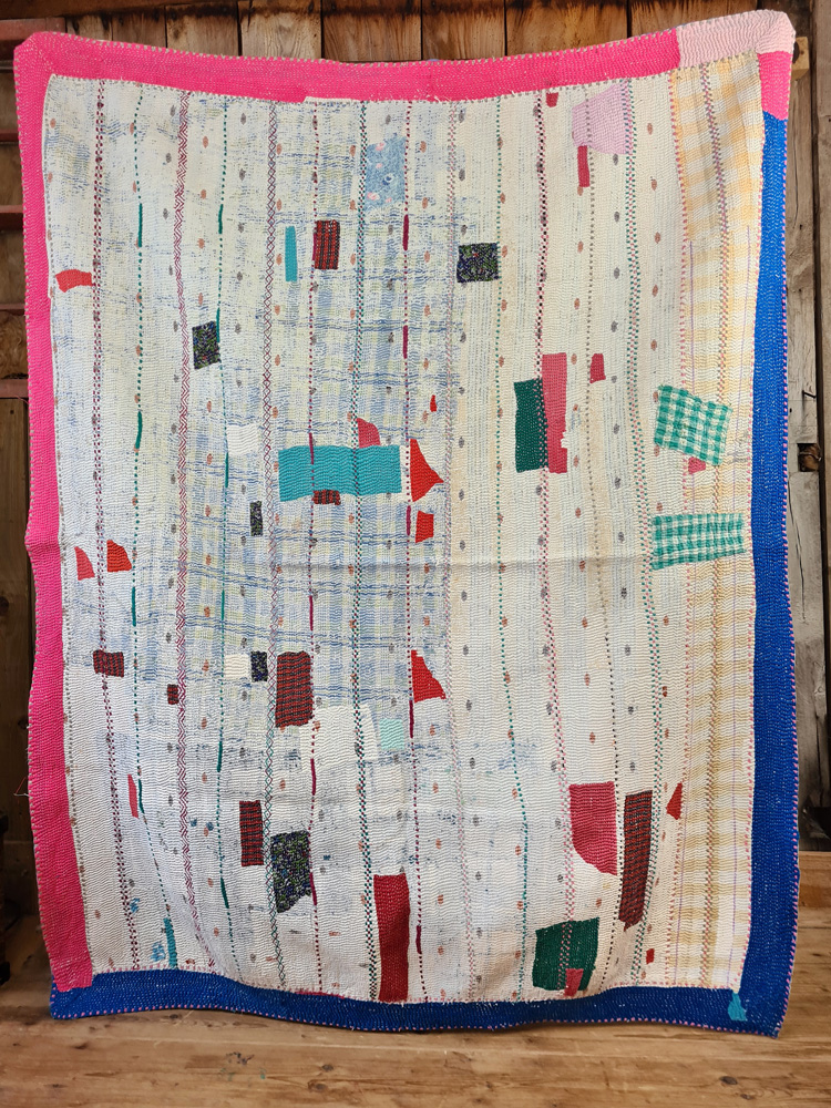 Exquisite vintage Kantha quilt featuring authentic hand-stitched Indian patchwork, responsibly sourced and perfect as unique homeware.