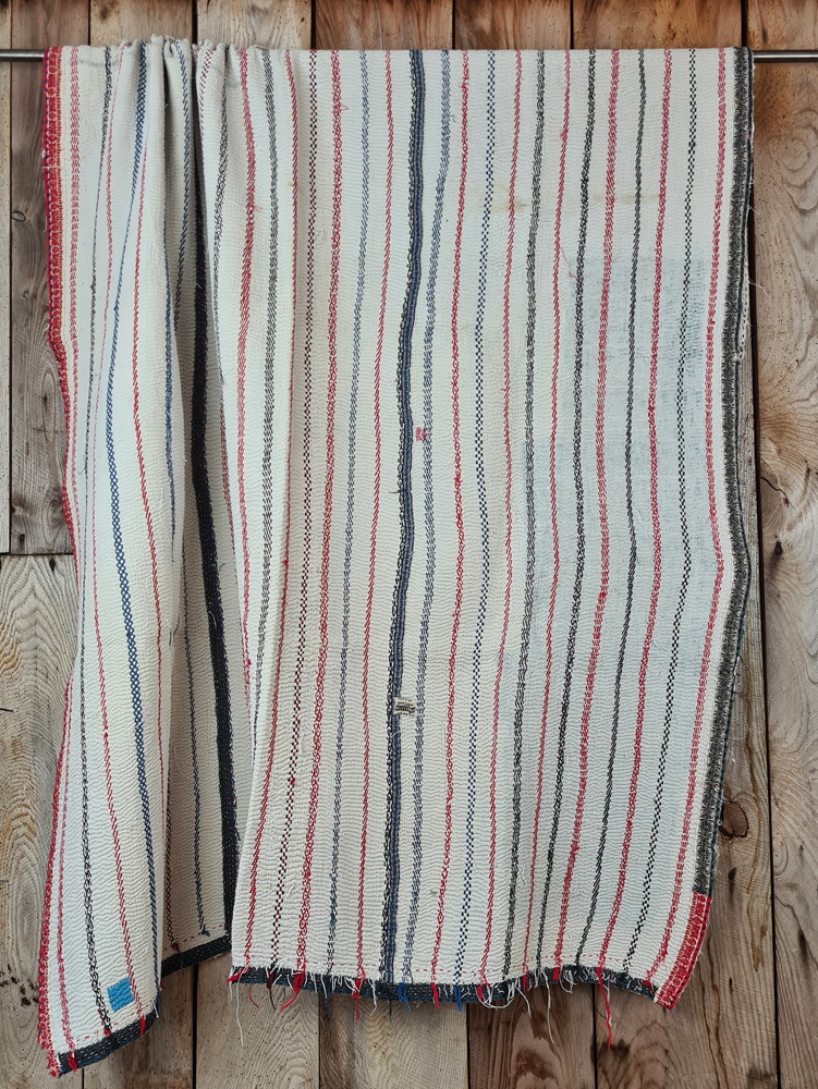 Exquisite vintage Kantha quilt featuring authentic hand-stitched Indian patchwork, responsibly sourced and perfect as unique homeware.