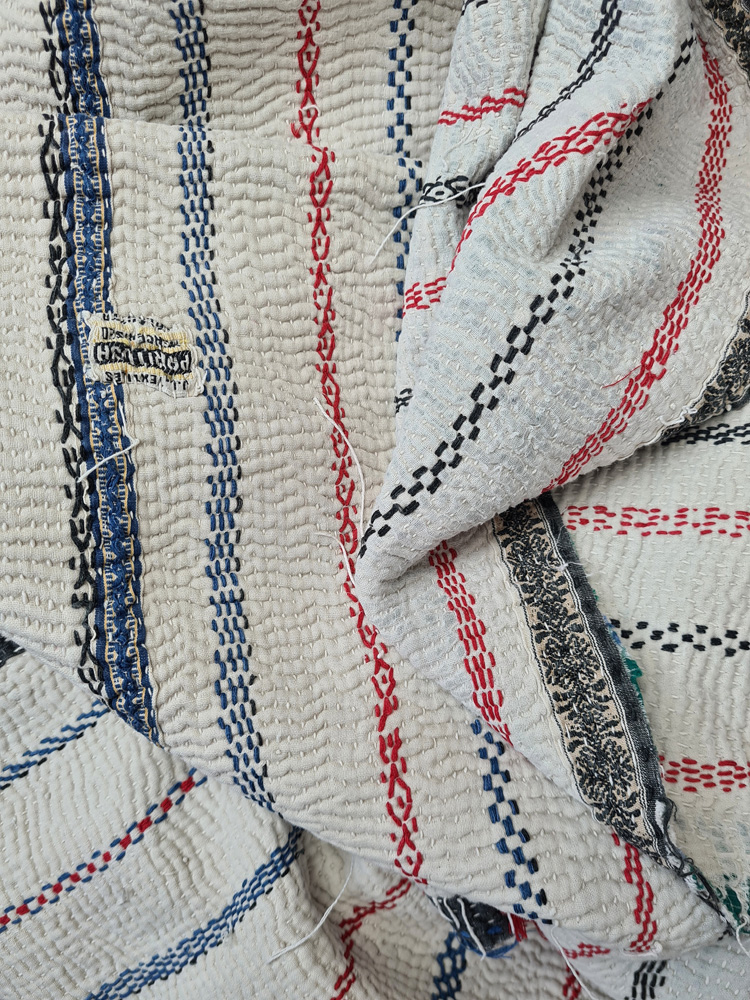 Exquisite vintage Kantha quilt featuring authentic hand-stitched Indian patchwork, responsibly sourced and perfect as unique homeware.