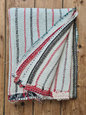 Exquisite vintage Kantha quilt featuring authentic hand-stitched Indian patchwork, responsibly sourced and perfect as unique homeware.