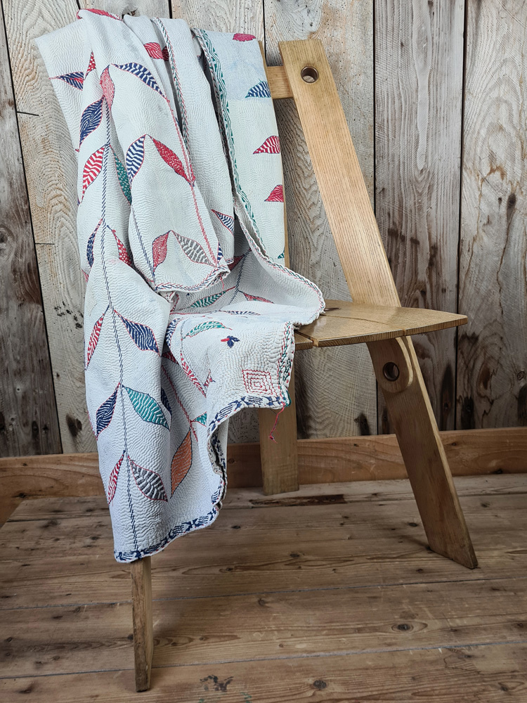 Exquisite vintage Kantha quilt featuring authentic hand-stitched Indian patchwork, responsibly sourced and perfect as unique homeware.