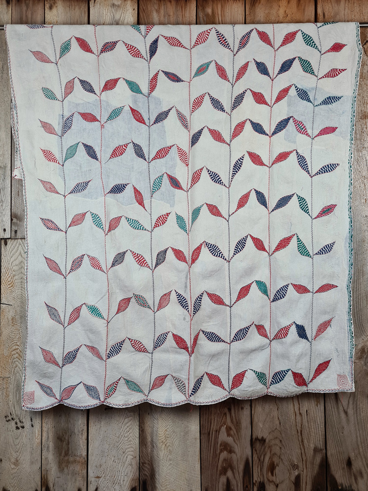 Exquisite vintage Kantha quilt featuring authentic hand-stitched Indian patchwork, responsibly sourced and perfect as unique homeware.