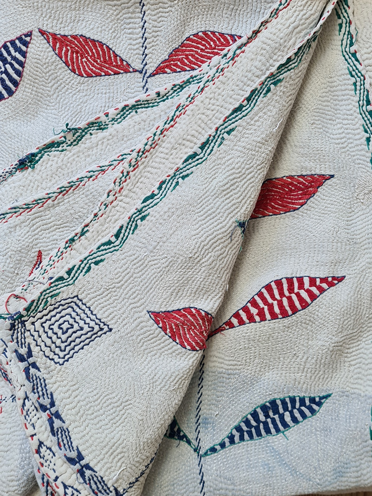 Exquisite vintage Kantha quilt featuring authentic hand-stitched Indian patchwork, responsibly sourced and perfect as unique homeware.