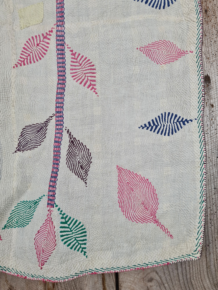 Exquisite vintage Kantha quilt featuring authentic hand-stitched Indian patchwork, responsibly sourced and perfect as unique homeware.