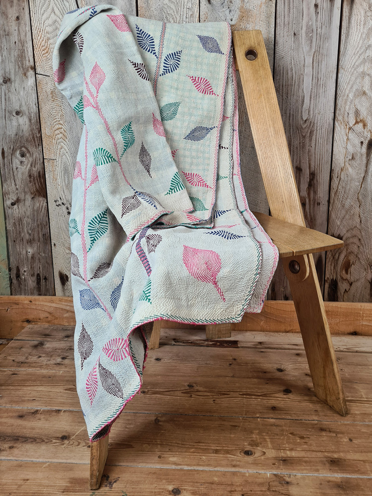 Exquisite vintage Kantha quilt featuring authentic hand-stitched Indian patchwork, responsibly sourced and perfect as unique homeware.