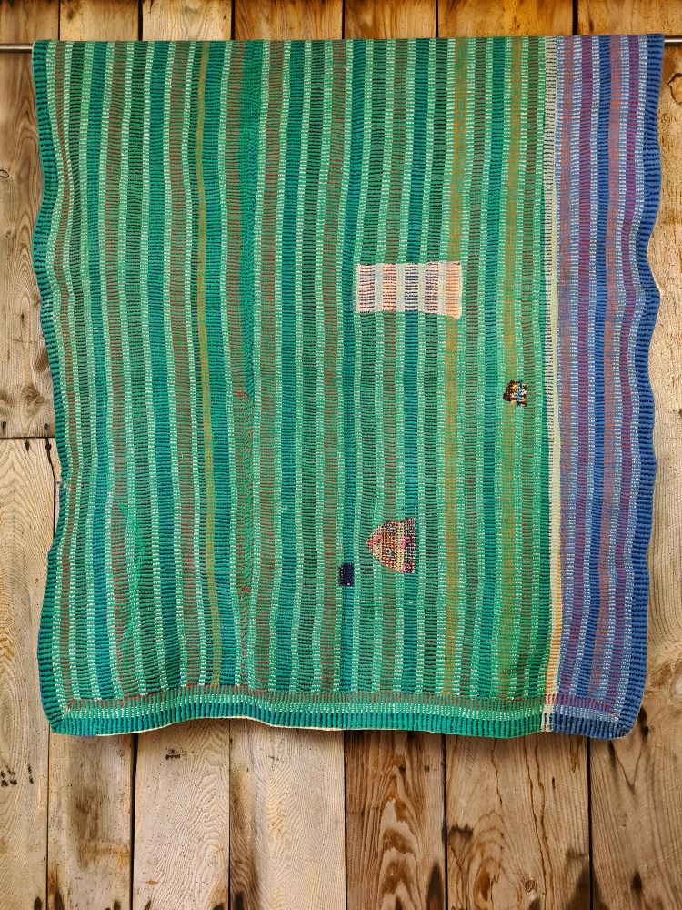 Exquisite vintage Kantha quilt featuring authentic hand-stitched Indian patchwork, responsibly sourced and perfect as unique homeware.