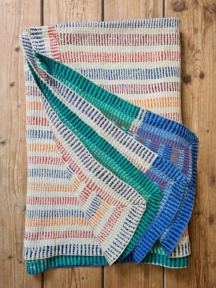 Exquisite vintage Kantha quilt featuring authentic hand-stitched Indian patchwork, responsibly sourced and perfect as unique homeware.