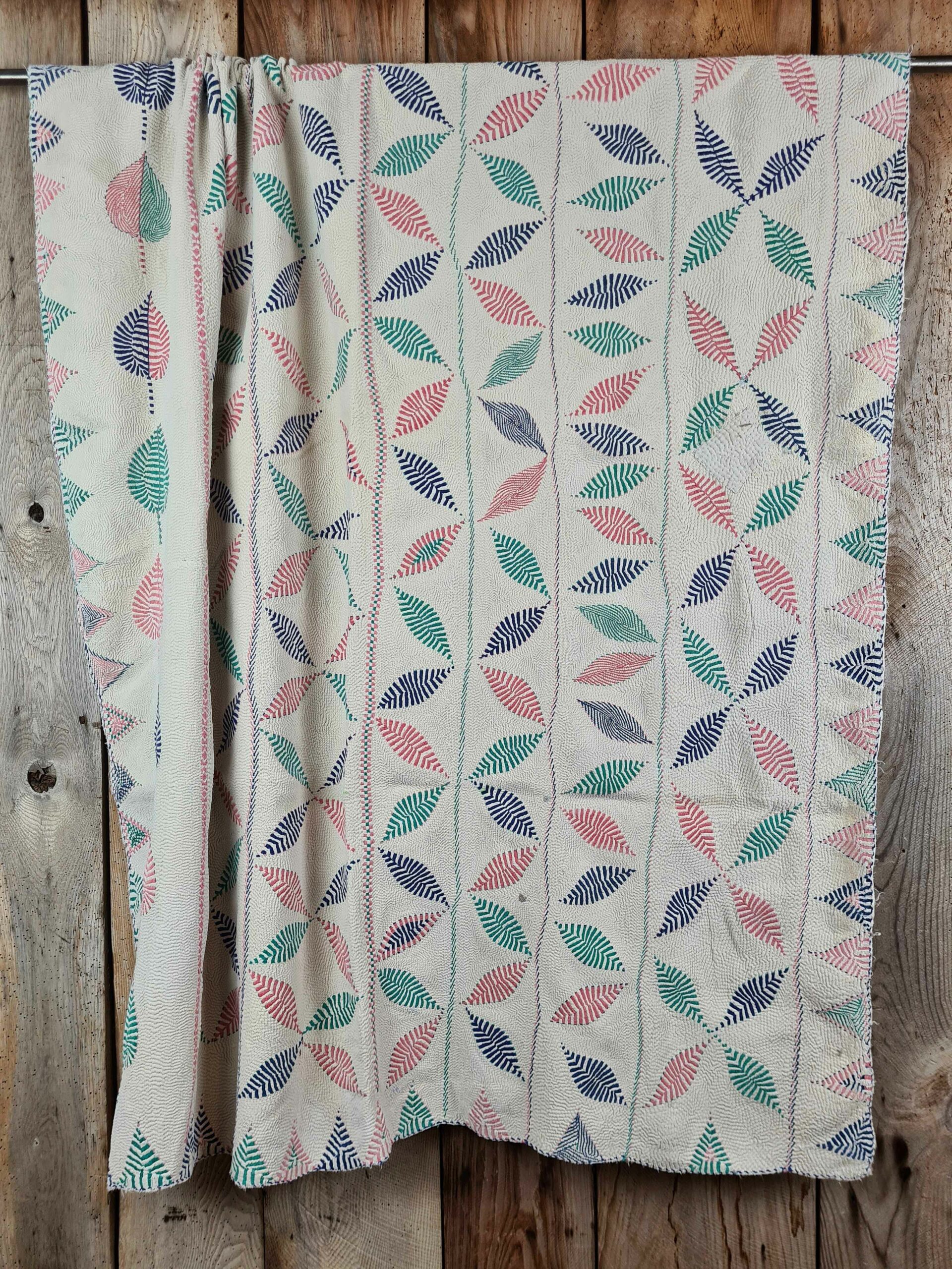 Exquisite vintage Kantha quilt featuring authentic hand-stitched Indian patchwork, responsibly sourced and perfect as unique homeware.