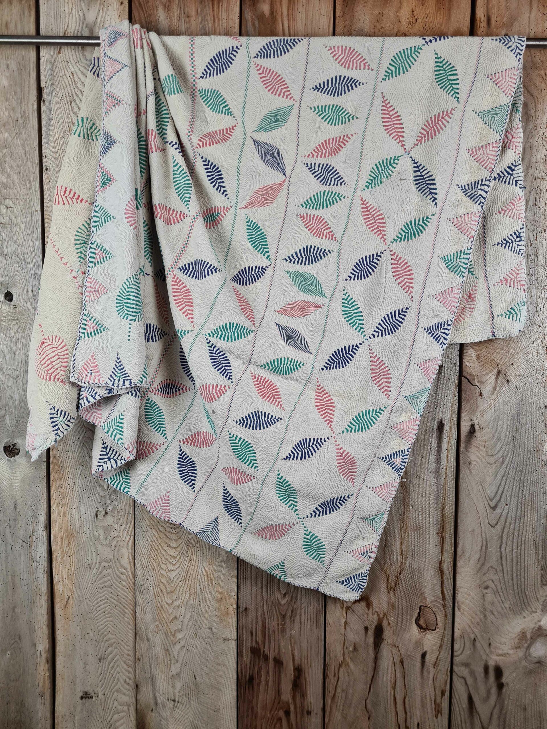 Exquisite vintage Kantha quilt featuring authentic hand-stitched Indian patchwork, responsibly sourced and perfect as unique homeware.