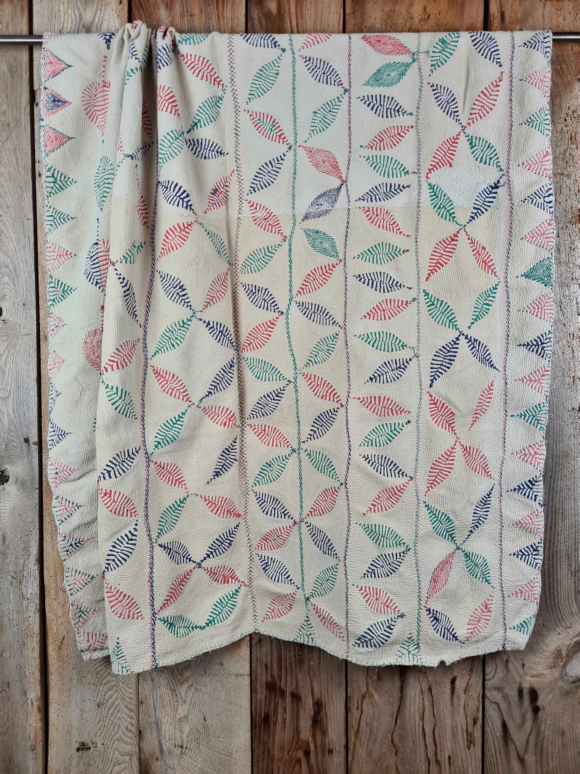 Exquisite vintage Kantha quilt featuring authentic hand-stitched Indian patchwork, responsibly sourced and perfect as unique homeware.