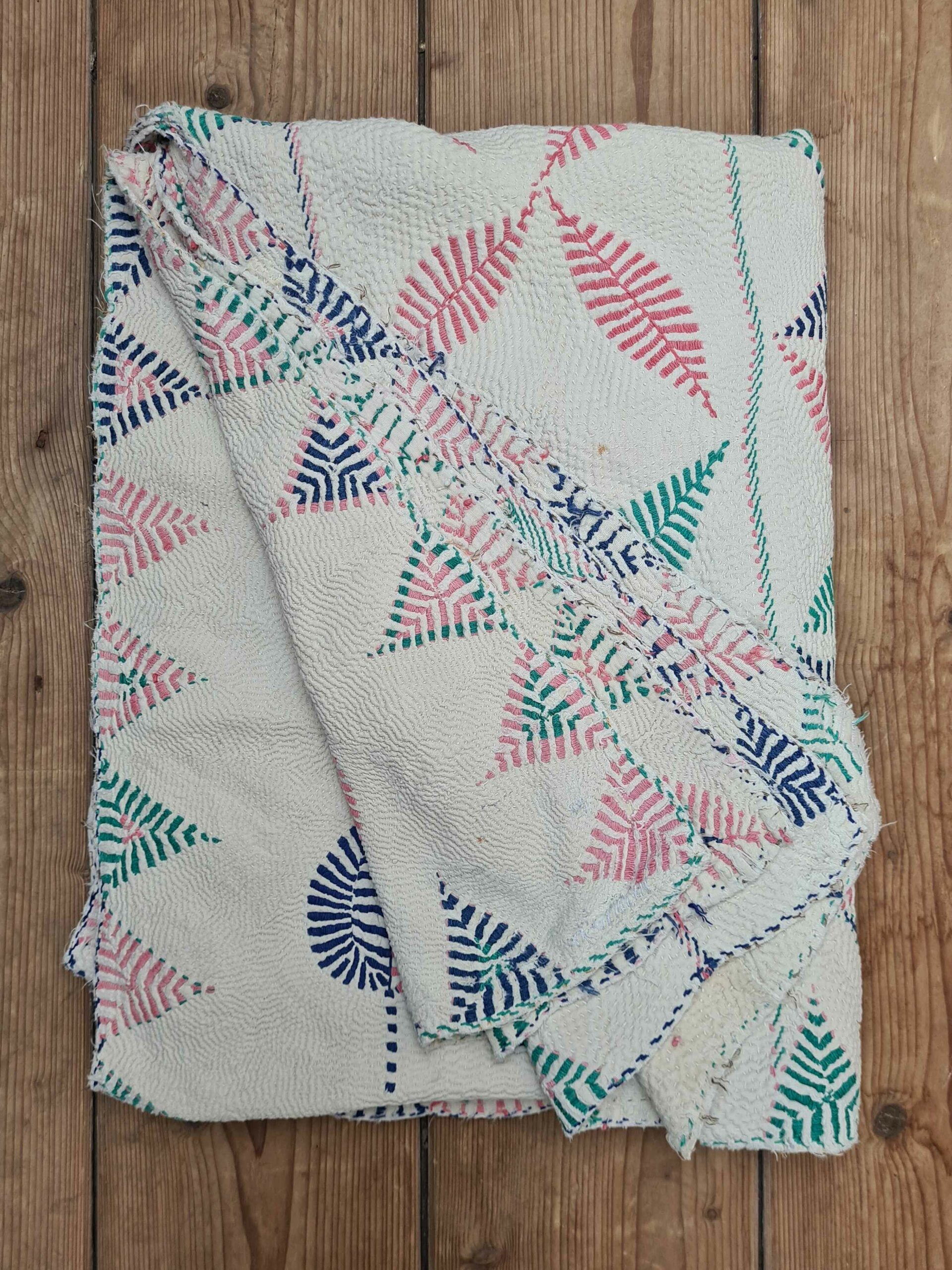 Exquisite vintage Kantha quilt featuring authentic hand-stitched Indian patchwork, responsibly sourced and perfect as unique homeware.