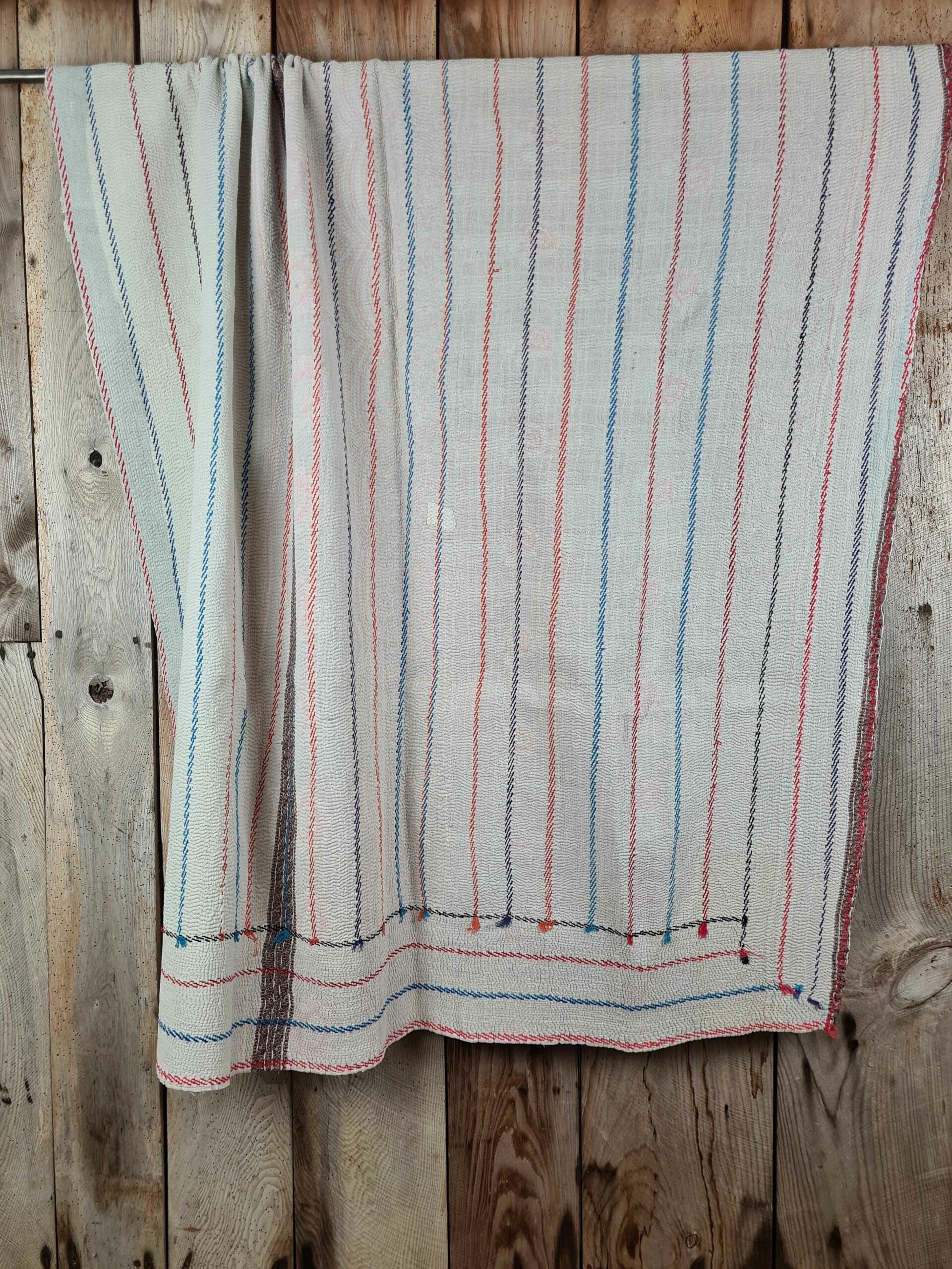 Exquisite vintage Kantha quilt featuring authentic hand-stitched Indian patchwork, responsibly sourced and perfect as unique homeware.