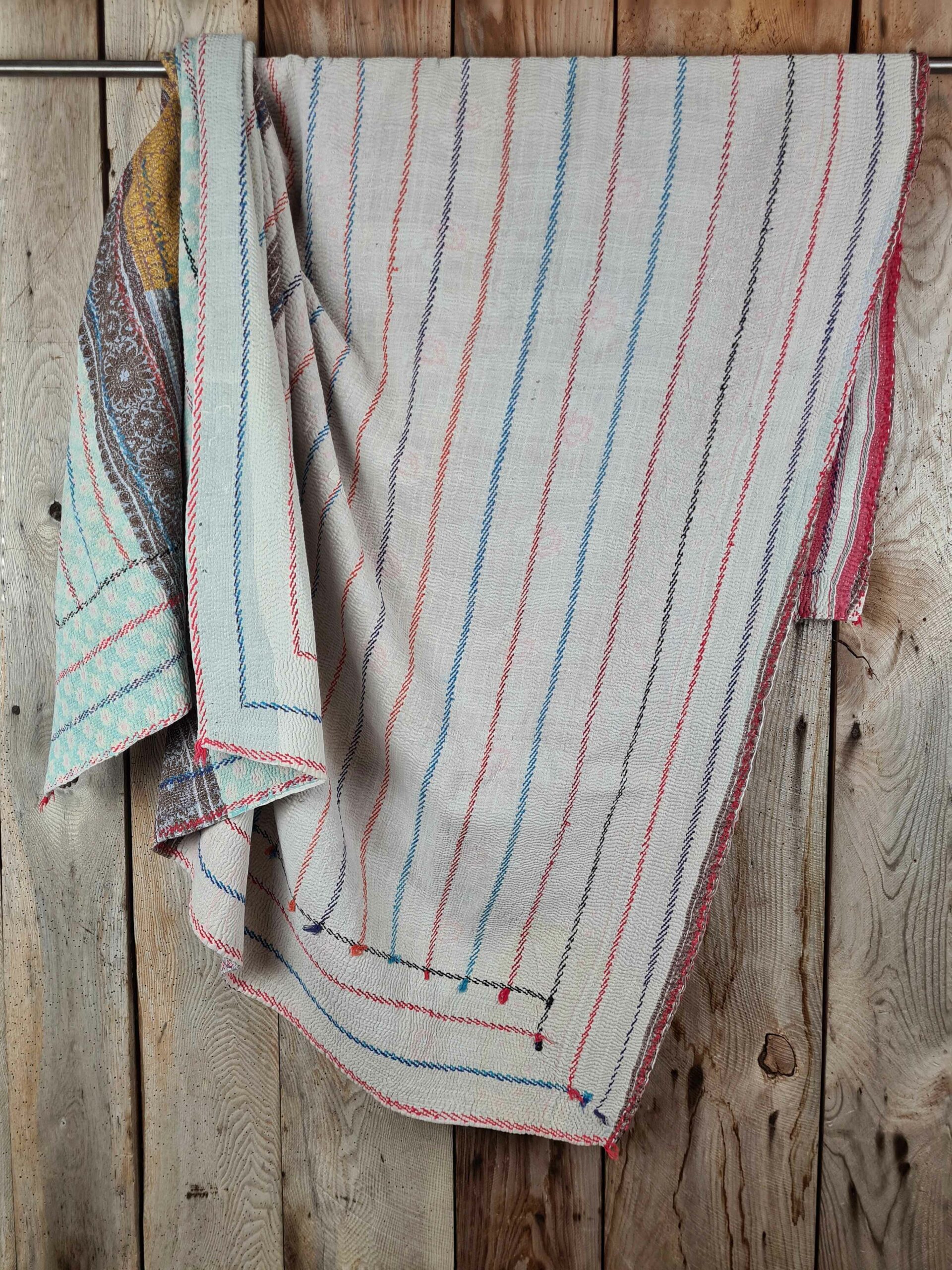 Exquisite vintage Kantha quilt featuring authentic hand-stitched Indian patchwork, responsibly sourced and perfect as unique homeware.
