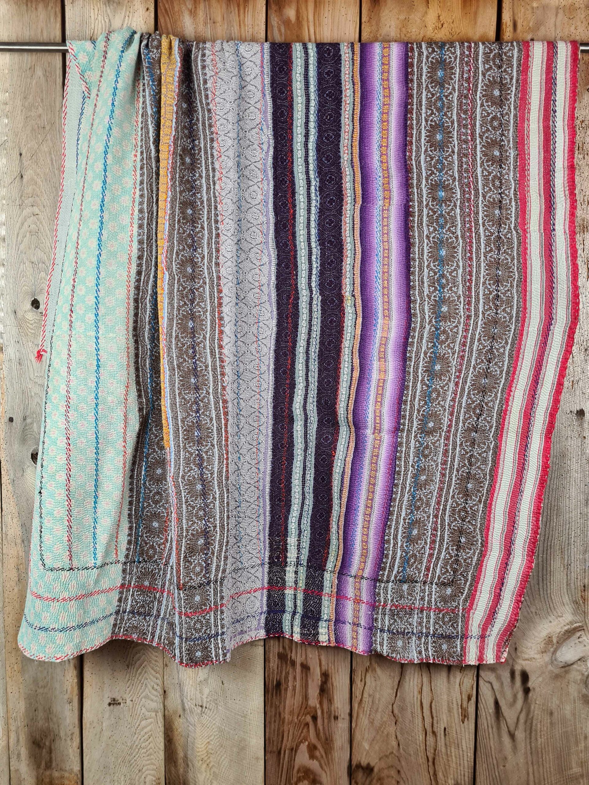 Exquisite vintage Kantha quilt featuring authentic hand-stitched Indian patchwork, responsibly sourced and perfect as unique homeware.