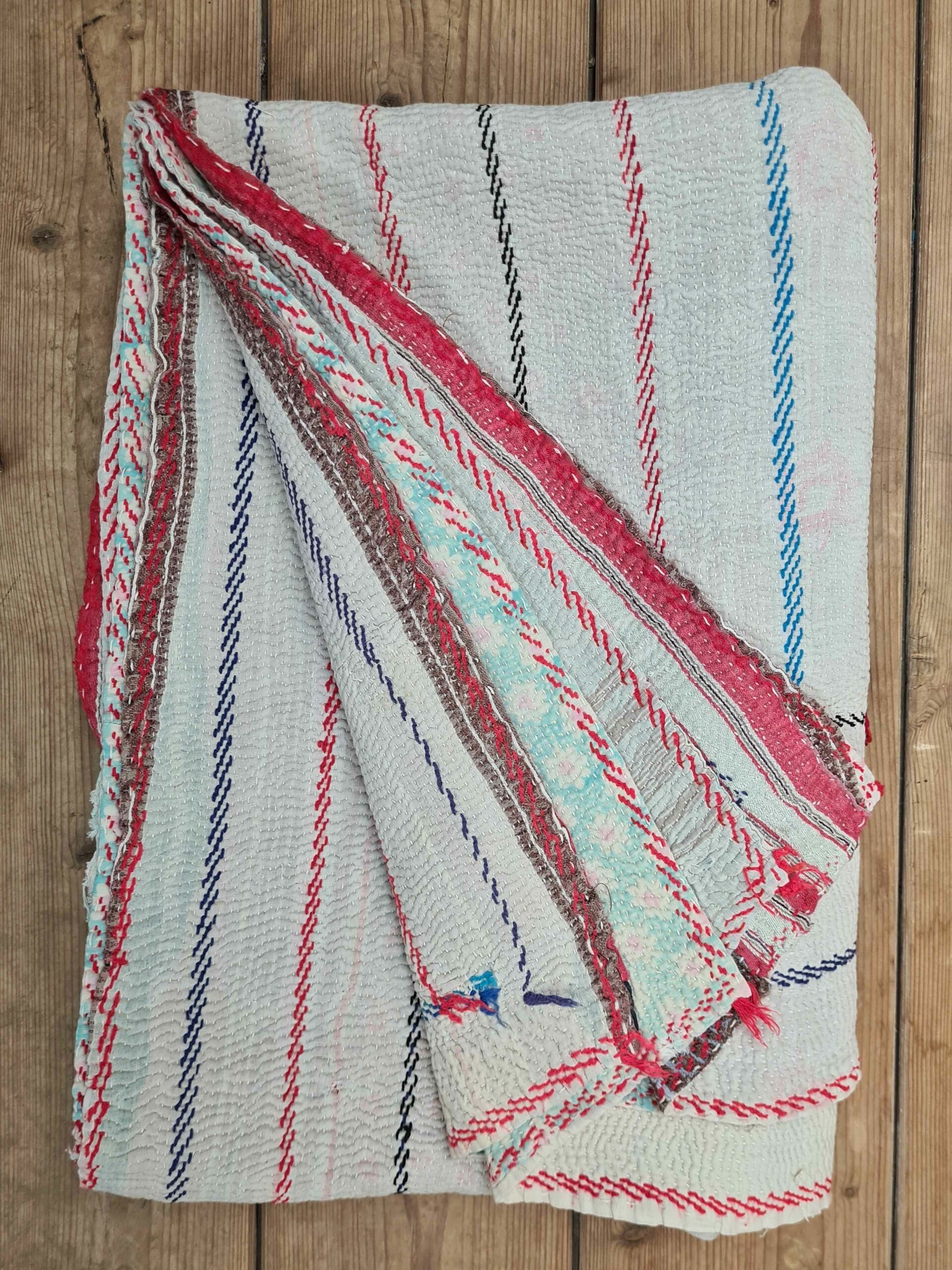 Exquisite vintage Kantha quilt featuring authentic hand-stitched Indian patchwork, responsibly sourced and perfect as unique homeware.