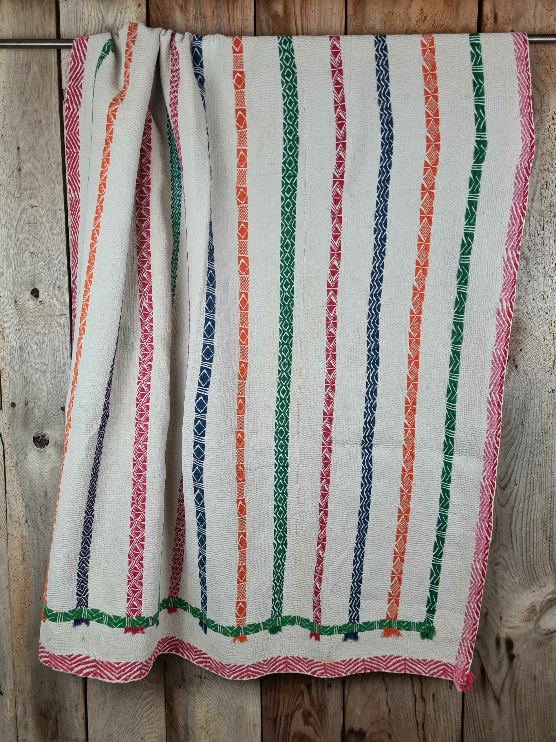 Exquisite vintage Kantha quilt featuring authentic hand-stitched Indian patchwork, responsibly sourced and perfect as unique homeware.