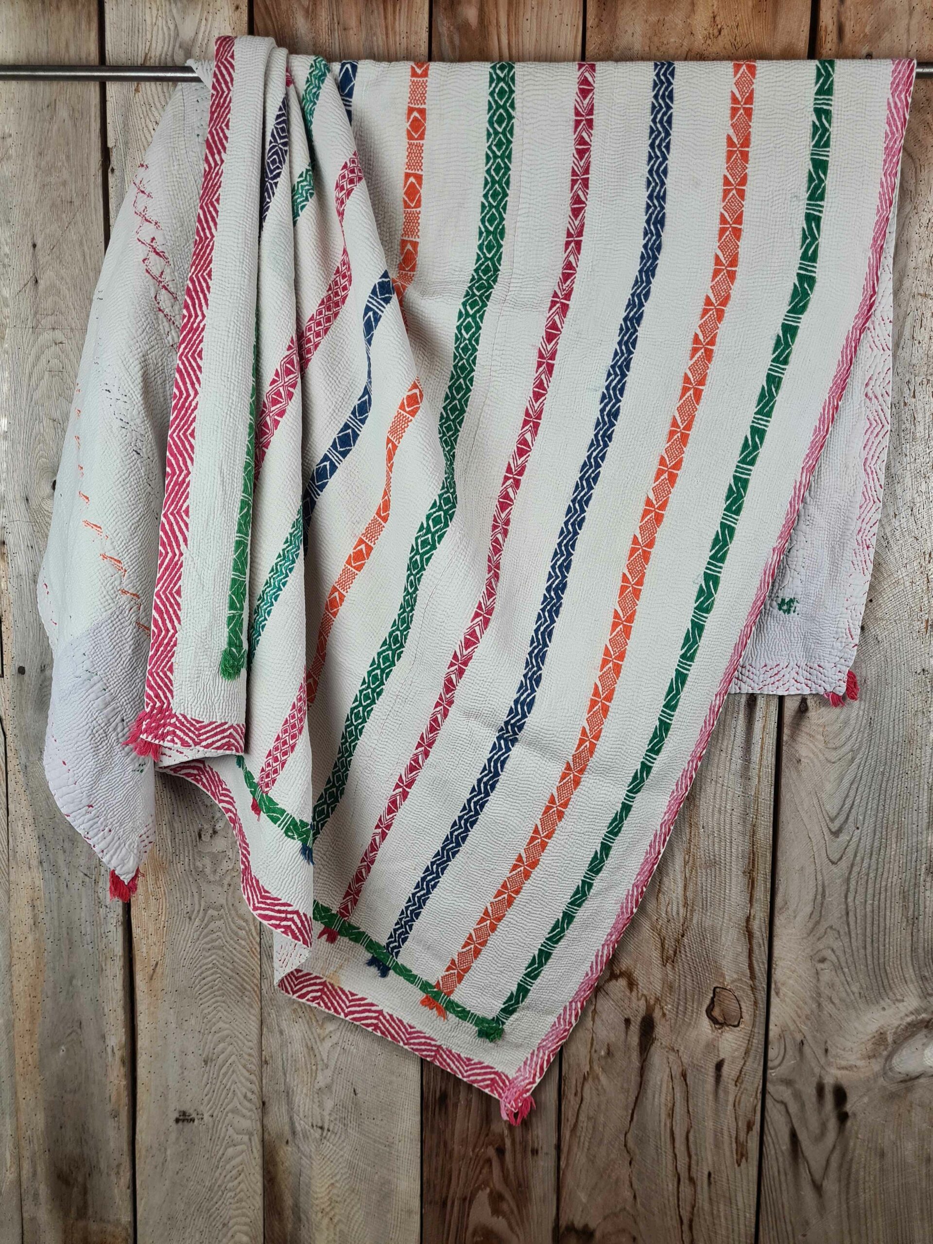 Exquisite vintage Kantha quilt featuring authentic hand-stitched Indian patchwork, responsibly sourced and perfect as unique homeware.
