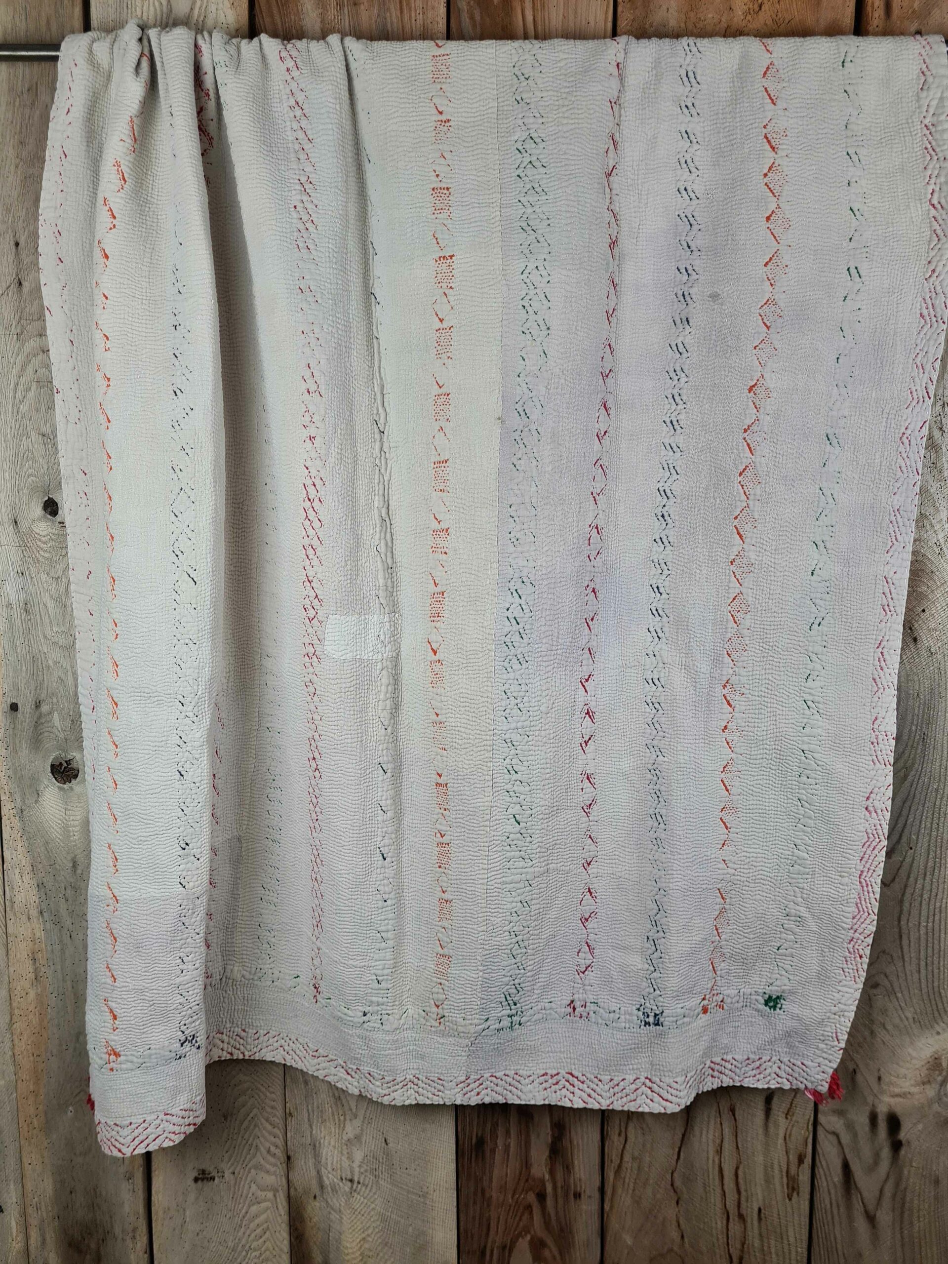 Exquisite vintage Kantha quilt featuring authentic hand-stitched Indian patchwork, responsibly sourced and perfect as unique homeware.
