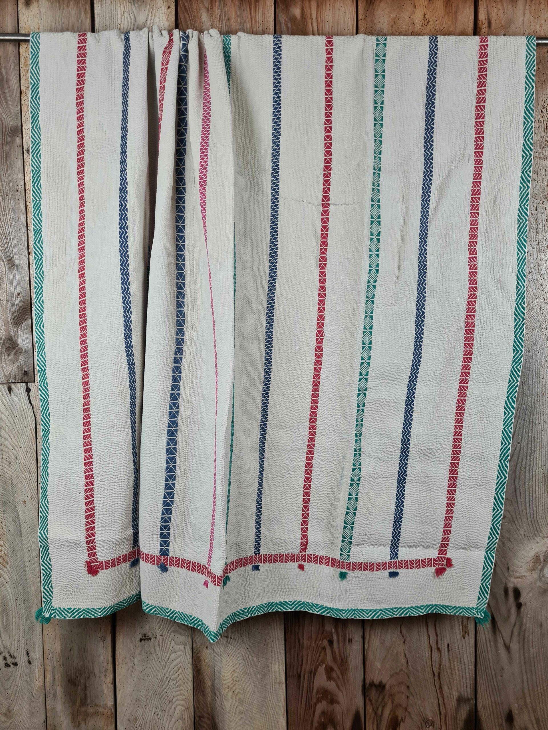 Exquisite vintage Kantha quilt featuring authentic hand-stitched Indian patchwork, responsibly sourced and perfect as unique homeware.