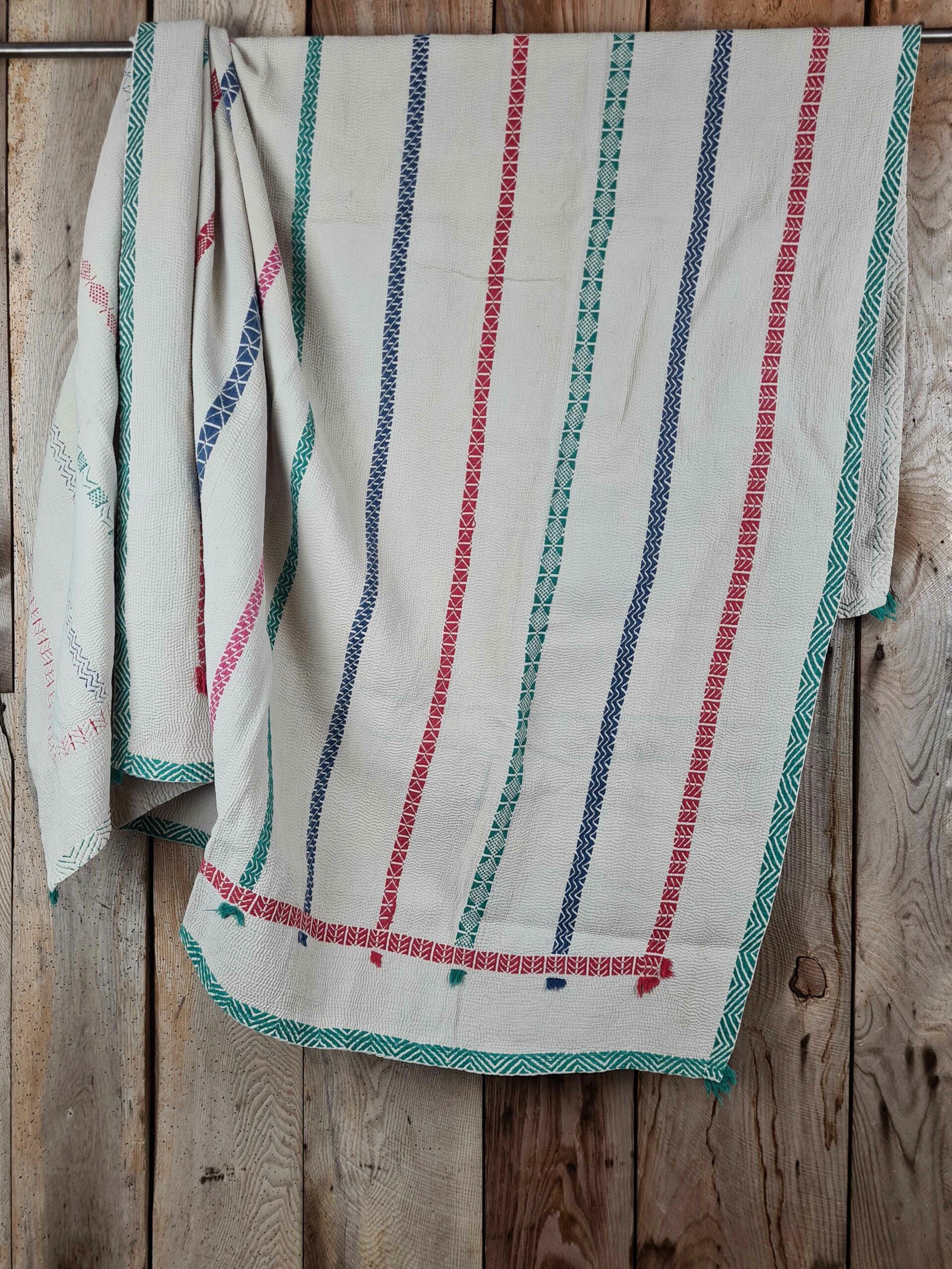 Exquisite vintage Kantha quilt featuring authentic hand-stitched Indian patchwork, responsibly sourced and perfect as unique homeware.
