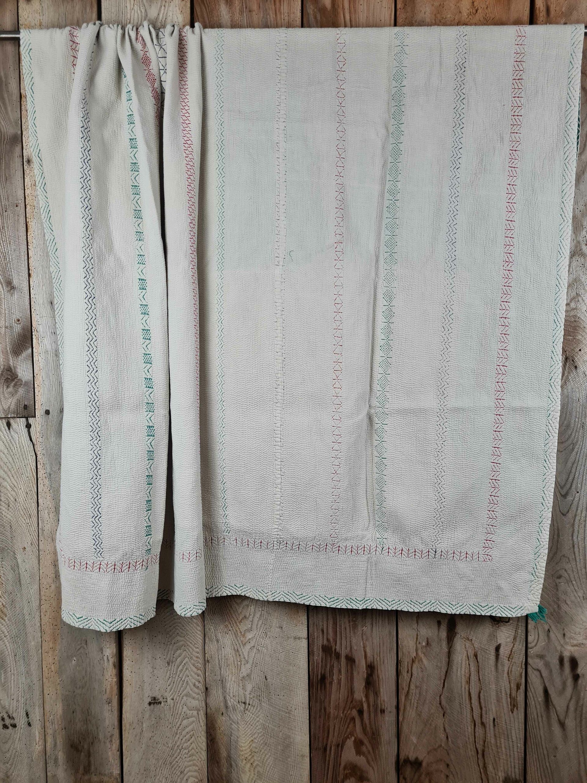 Exquisite vintage Kantha quilt featuring authentic hand-stitched Indian patchwork, responsibly sourced and perfect as unique homeware.