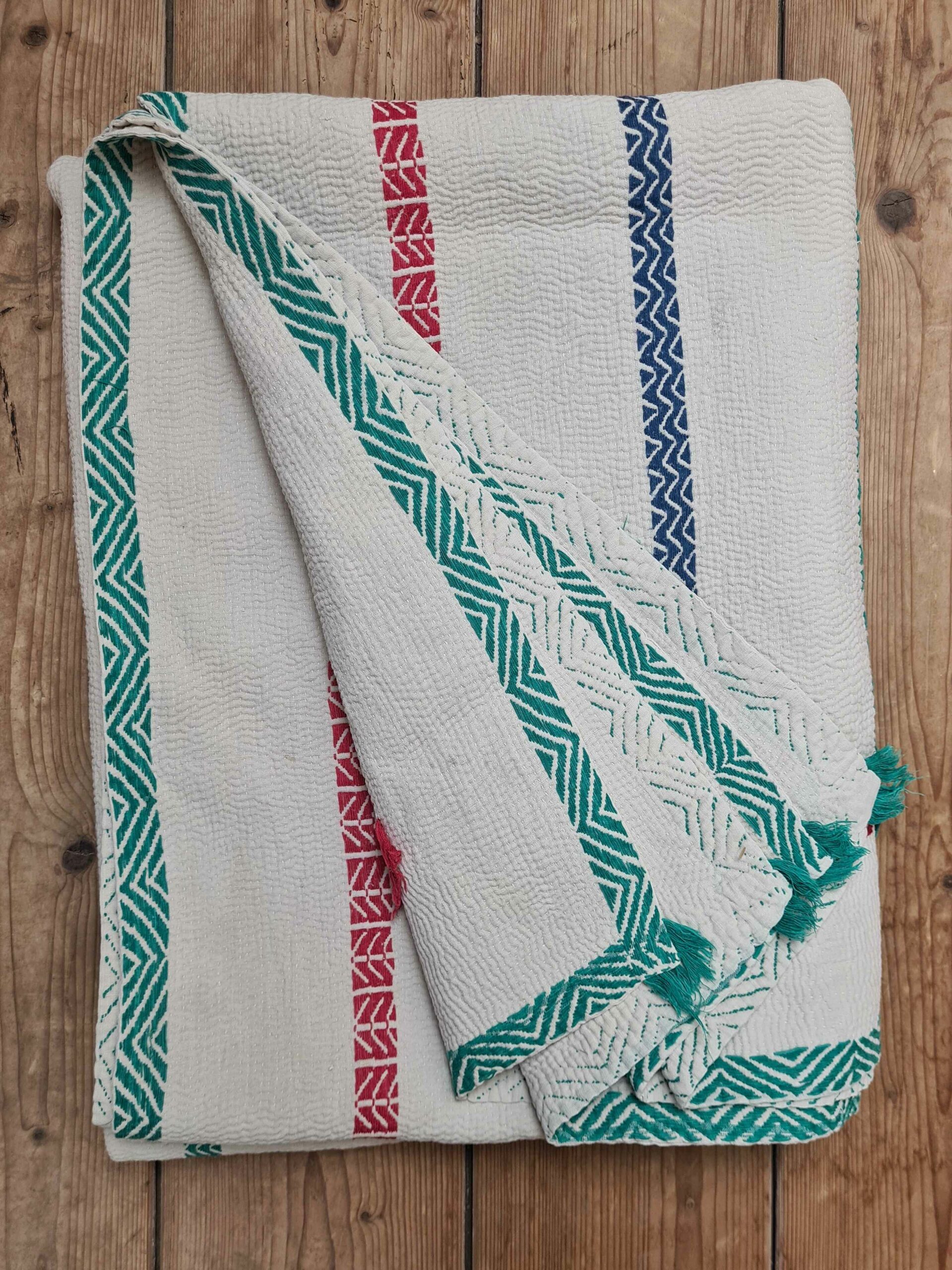 Exquisite vintage Kantha quilt featuring authentic hand-stitched Indian patchwork, responsibly sourced and perfect as unique homeware.