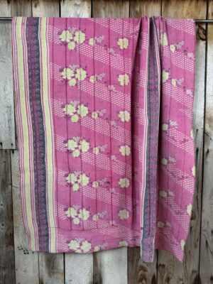 Exquisite vintage Kantha quilt featuring authentic hand-stitched Indian patchwork, responsibly sourced and perfect as unique homeware.