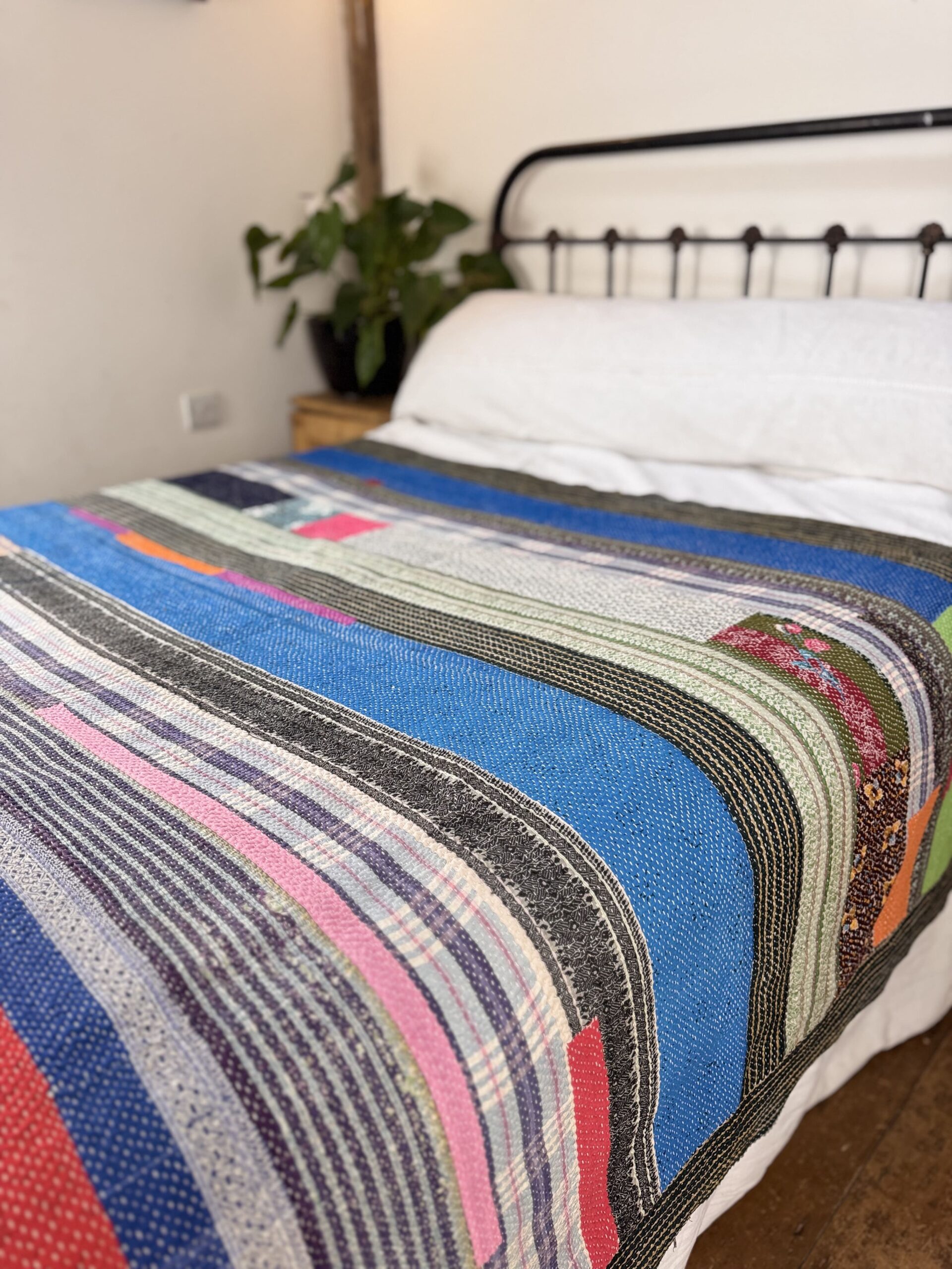 Exquisite vintage Kantha quilt featuring authentic hand-stitched Indian patchwork, responsibly sourced and perfect as unique homeware.