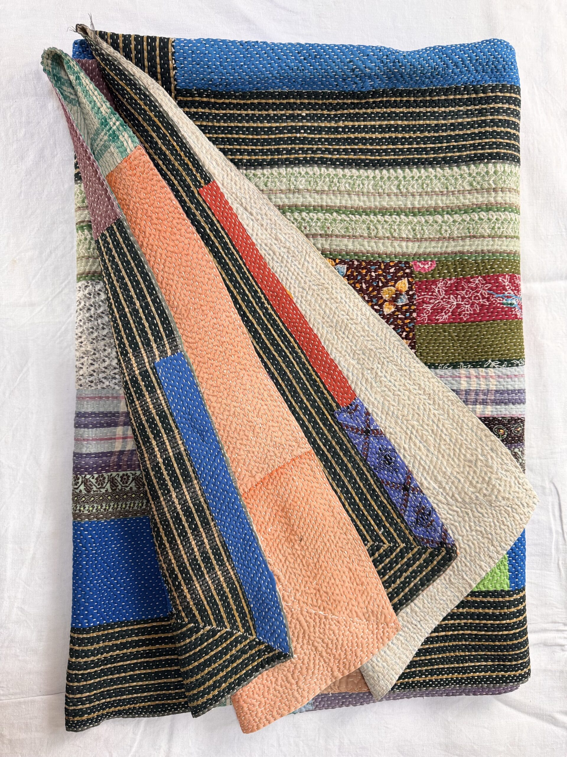 Exquisite vintage Kantha quilt featuring authentic hand-stitched Indian patchwork, responsibly sourced and perfect as unique homeware.