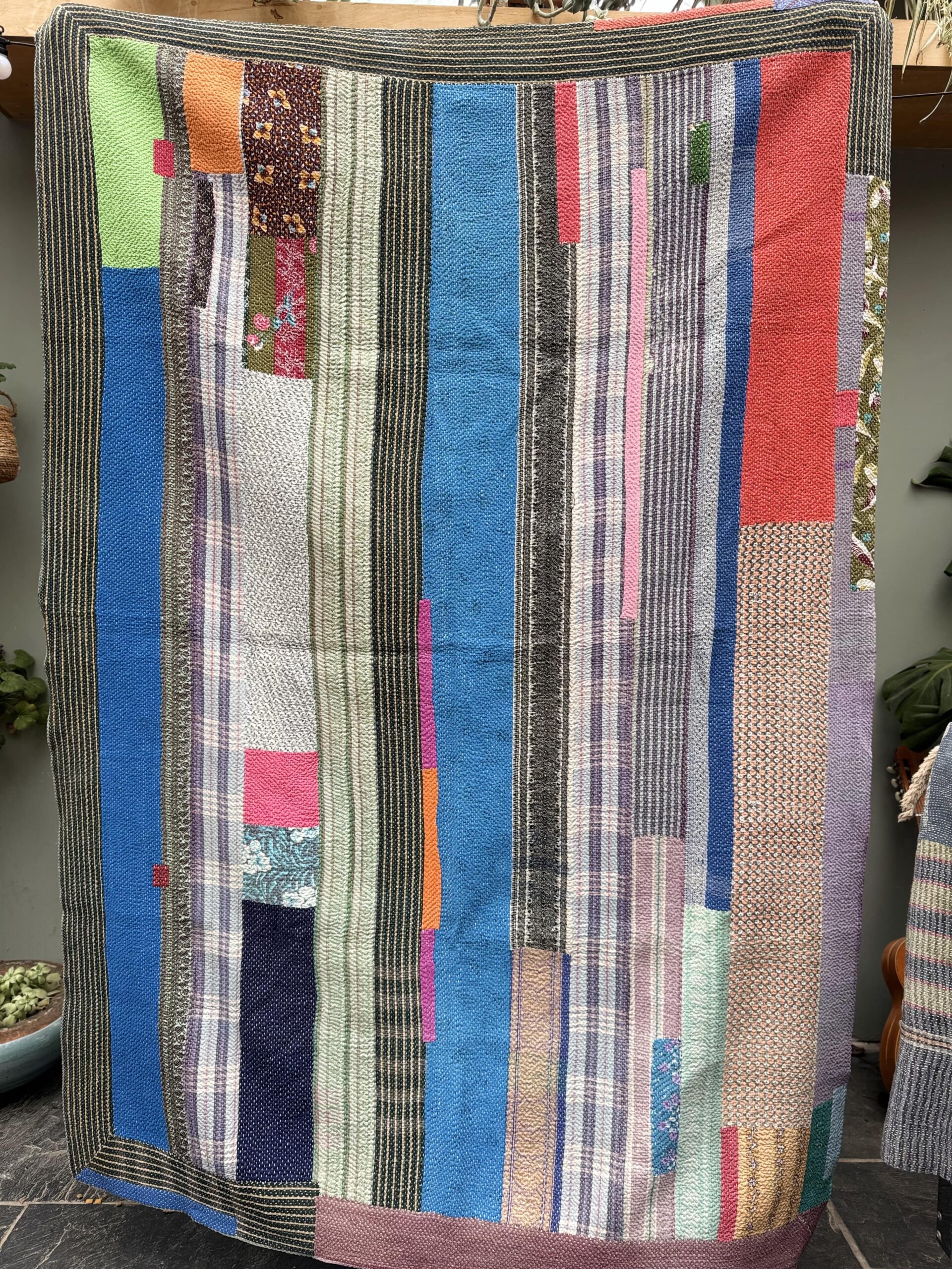 Exquisite vintage Kantha quilt featuring authentic hand-stitched Indian patchwork, responsibly sourced and perfect as unique homeware.