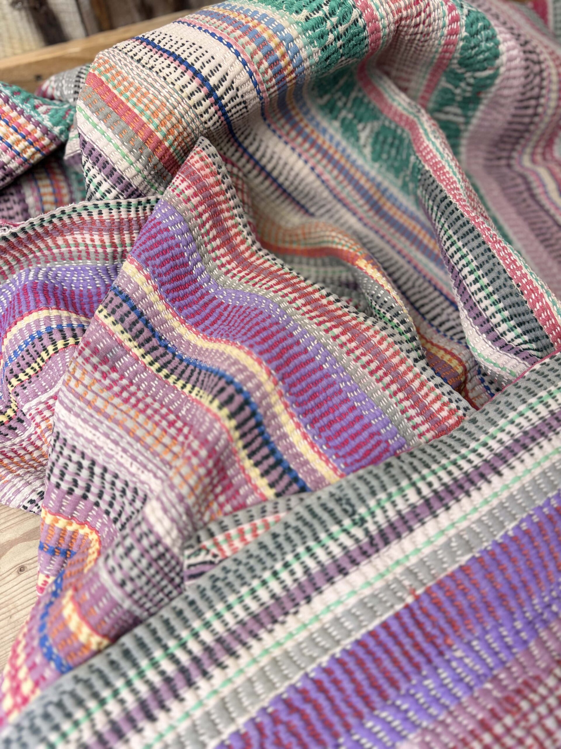 Exquisite vintage Kantha quilt featuring authentic hand-stitched Indian patchwork, responsibly sourced and perfect as unique homeware.