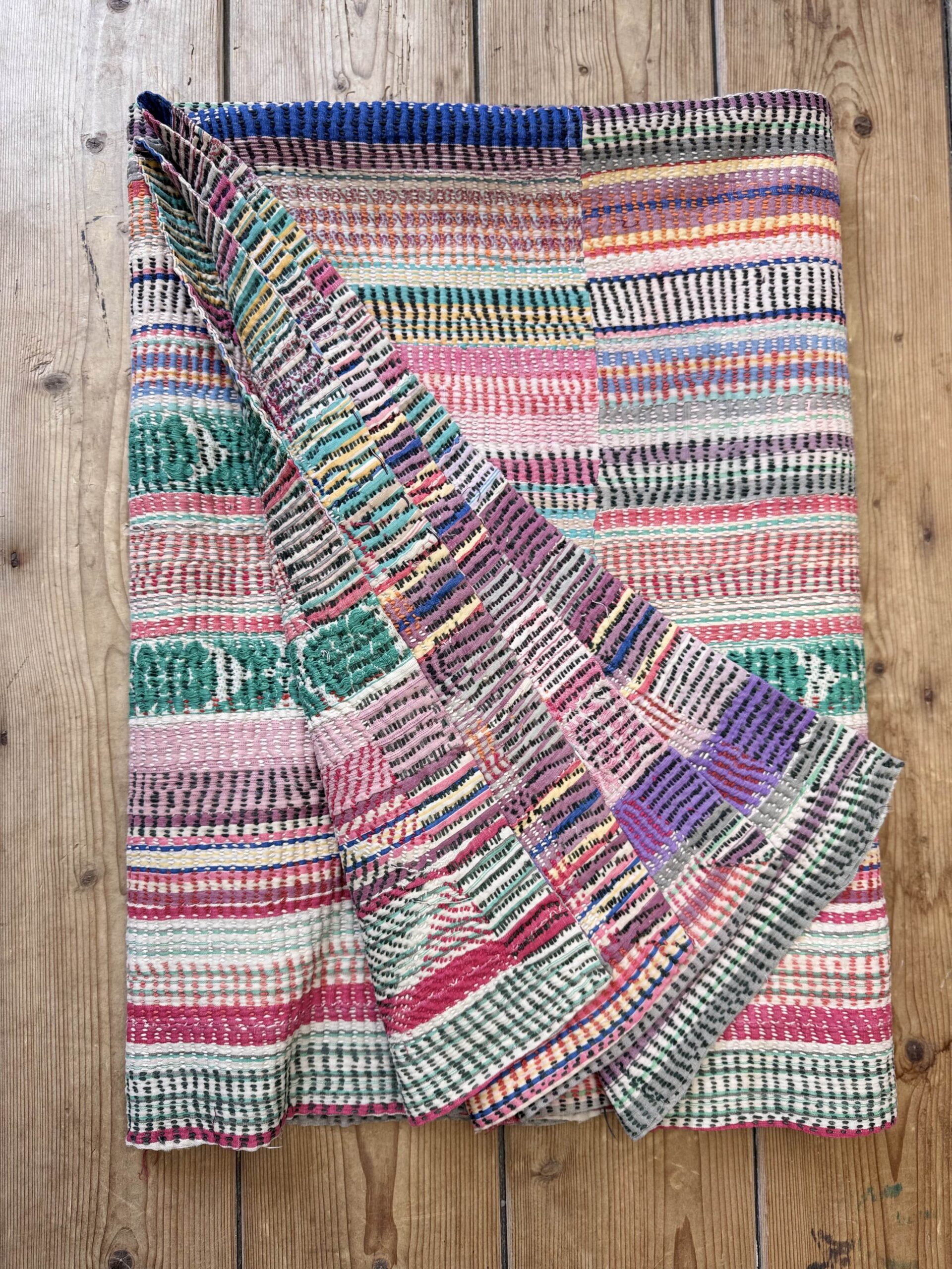 Exquisite vintage Kantha quilt featuring authentic hand-stitched Indian patchwork, responsibly sourced and perfect as unique homeware.