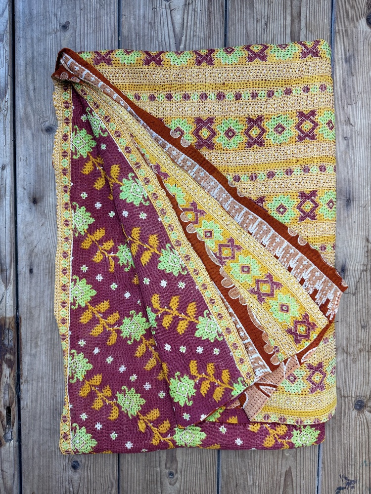 Exquisite vintage Kantha quilt featuring authentic hand-stitched Indian patchwork, responsibly sourced and perfect as unique homeware.