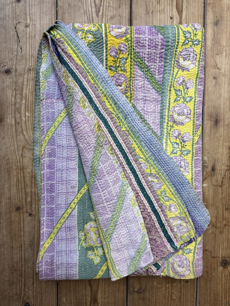Exquisite vintage Kantha quilt featuring authentic hand-stitched Indian patchwork, responsibly sourced and perfect as unique homeware.