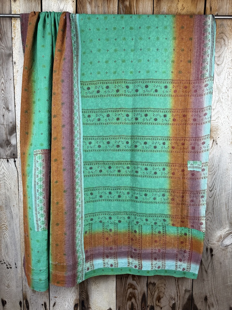 Exquisite vintage Kantha quilt featuring authentic hand-stitched Indian patchwork, responsibly sourced and perfect as unique homeware.