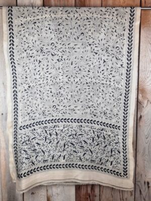 A tussar silk scarf/shawl hand-embroidered with traditional motifs by a NGO in West Bengal.