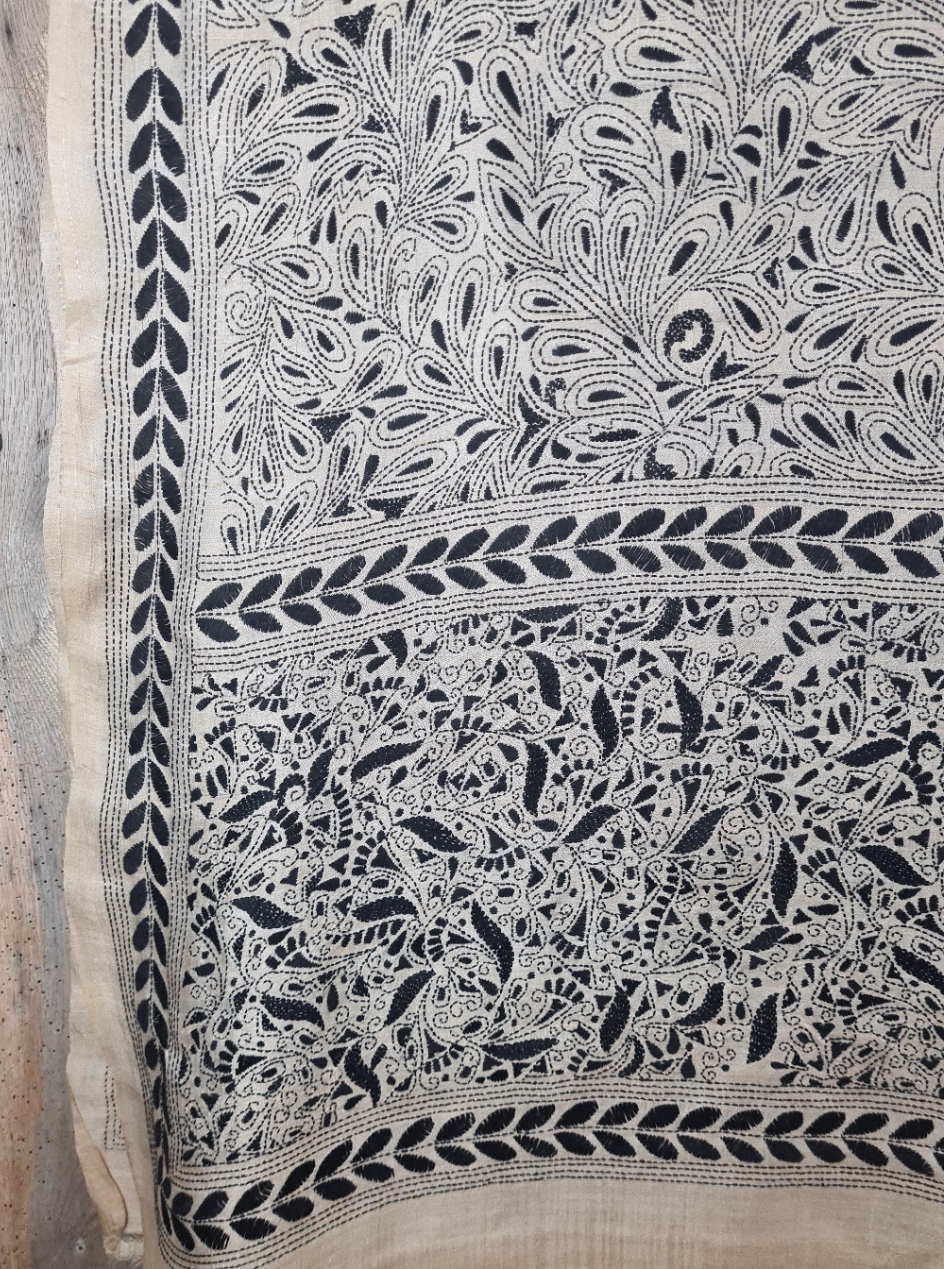 A tussar silk scarf/shawl hand-embroidered with traditional motifs by a NGO in West Bengal.