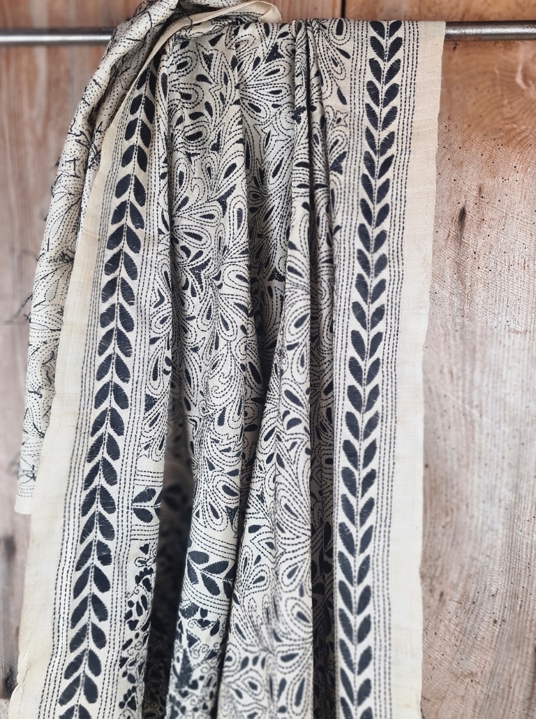 A tussar silk scarf/shawl hand-embroidered with traditional motifs by a NGO in West Bengal.