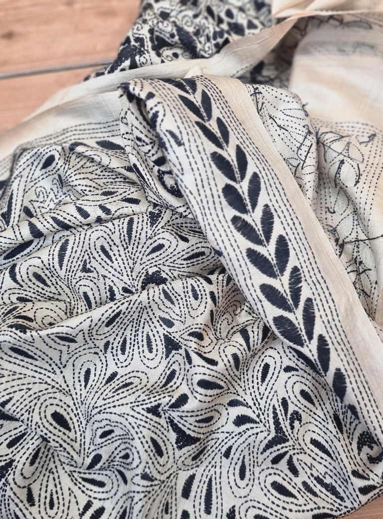 A tussar silk scarf/shawl hand-embroidered with traditional motifs by a NGO in West Bengal.