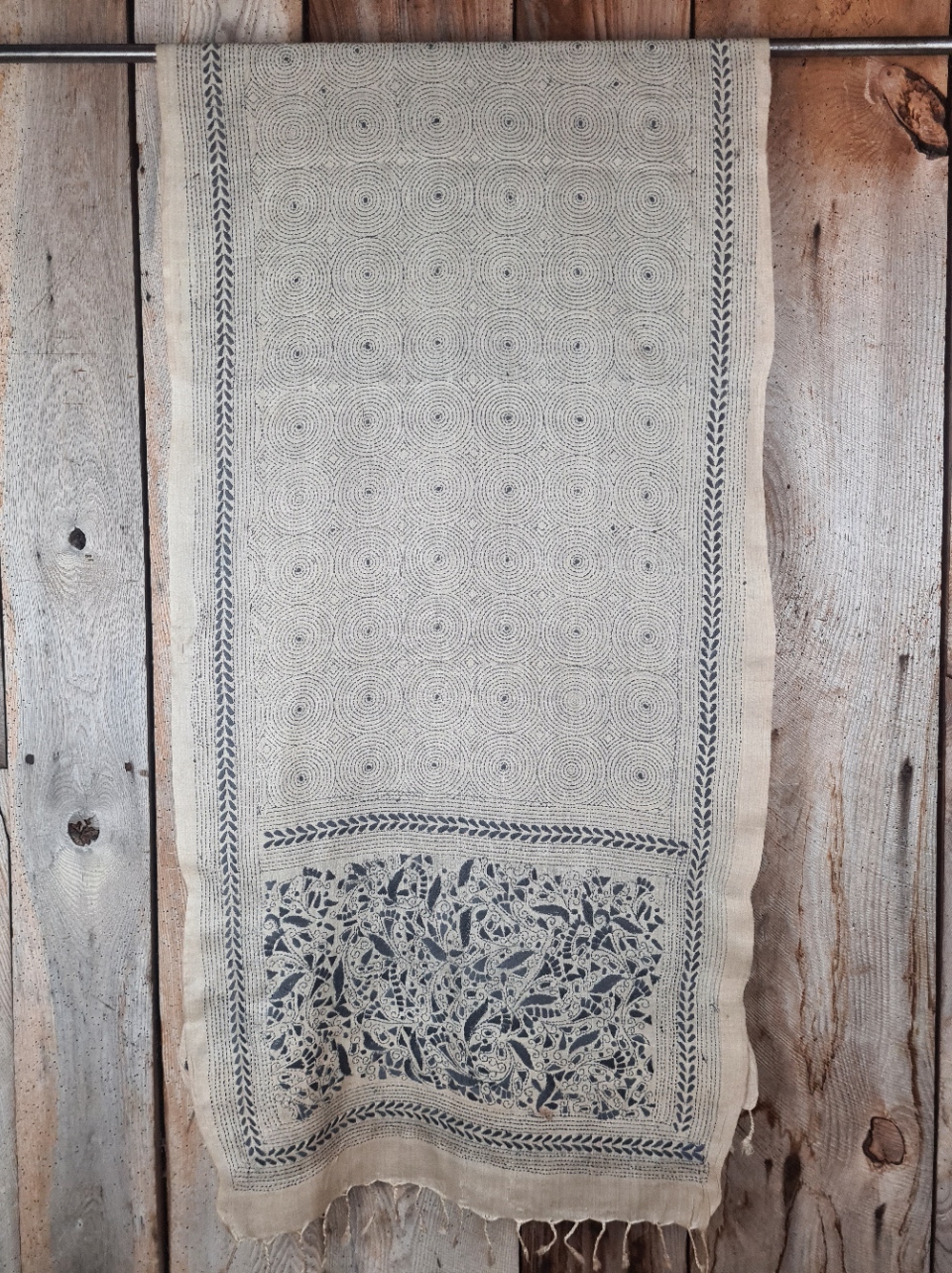 A tussar silk scarf/shawl hand-embroidered with traditional motifs by a NGO in West Bengal.