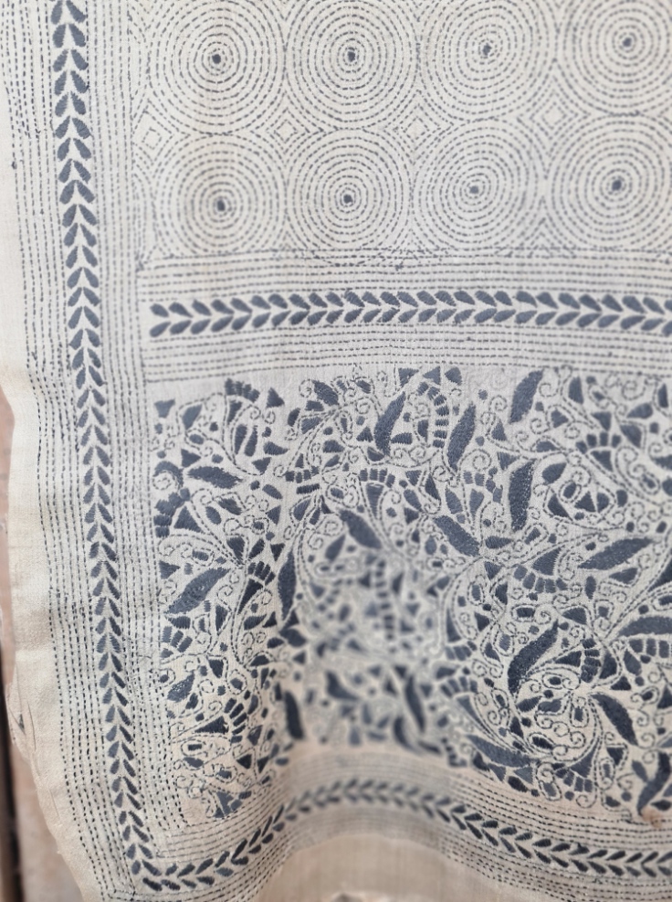 A tussar silk scarf/shawl hand-embroidered with traditional motifs by a NGO in West Bengal.